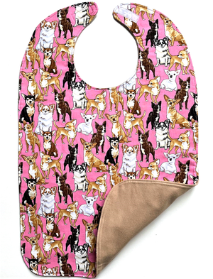 Front and back side of "Dog Show" pink premium cotton adult bib, featuring three layers of cotton and a soft beige cotton flannel back side.