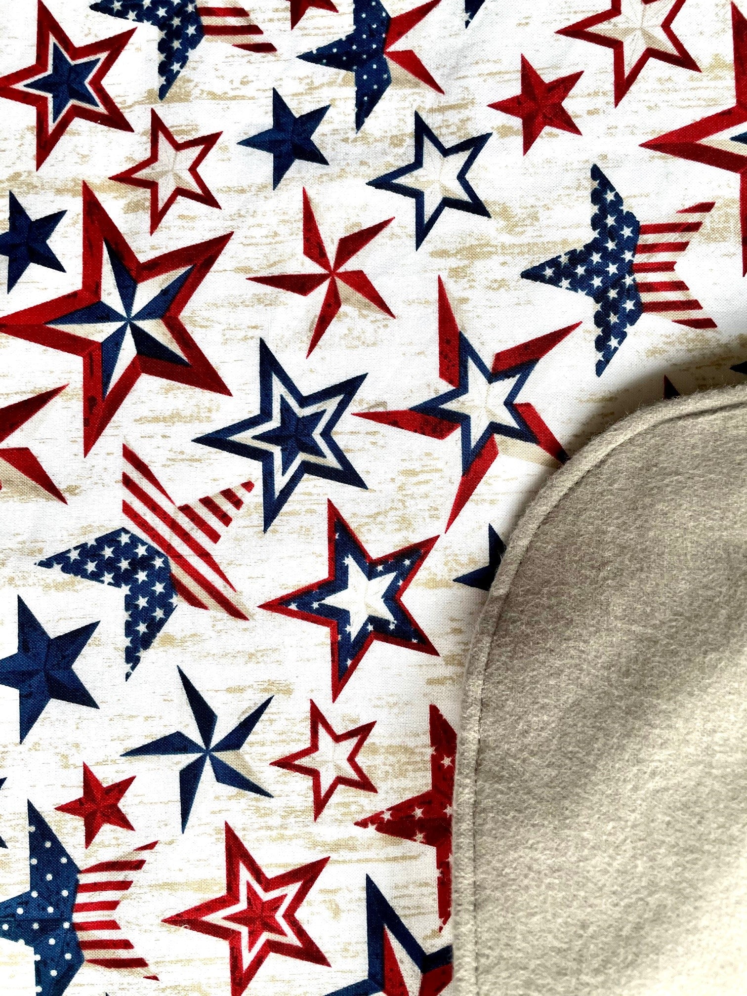 A close up of the premium cotton fabric used to make Stars + Stripes Bavette adult bib