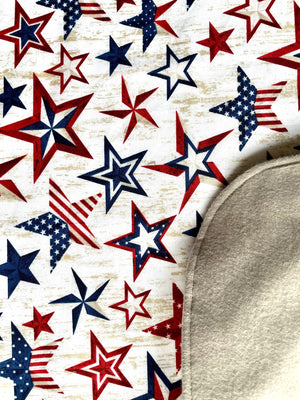 A close up of the premium cotton fabric used to make Stars + Stripes Bavette adult bib