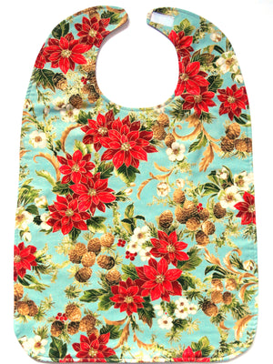 Holiday BAVETTE adult bib with red poinsettias, pine cones and gold thread design, on three layers of machine washable premium cotton, Velcro back closure, 26" x 17" 