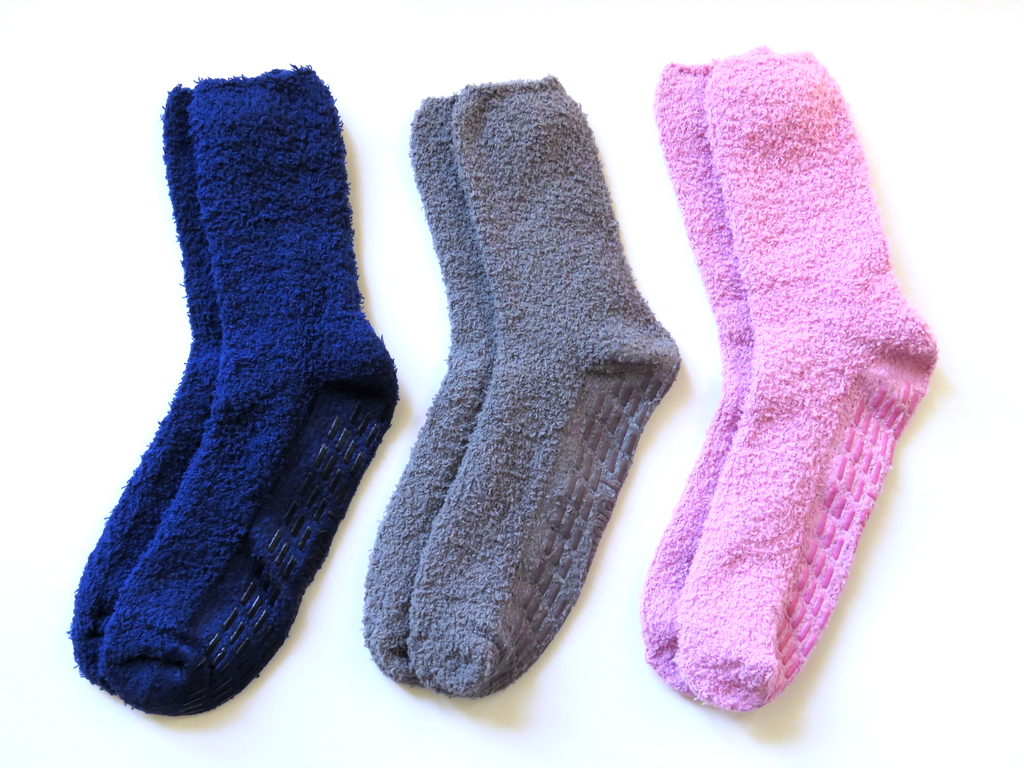 Three soft chenille, non-skid socks in different color otions: dark blue, gray and pink