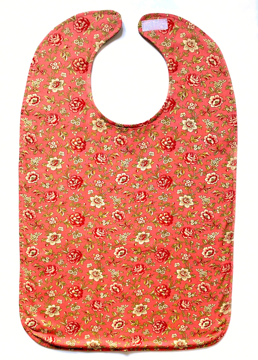 Dusty rose BAVETTE adult bib with small beige and red roses, and three layers of machine washable premium cotton, Velcro back closure, 26" x 17" 